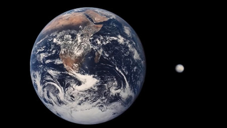 Image comparing the sizes of Pluto and Earth.の写真素材