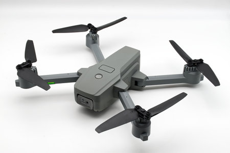 Drone with black propellers ready for flight isolated on white background.の写真素材