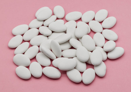 Jordan almonds isolated on pink background.の写真素材