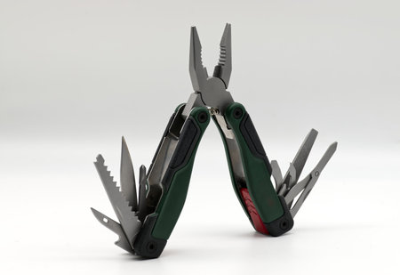 Multi tool with multiple functions and pliers isolated on white.の写真素材