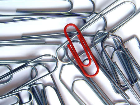 Leader Red clip among silver clipsの写真素材