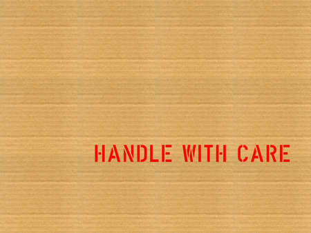 Corrugated cardboard with handle with care labelの写真素材