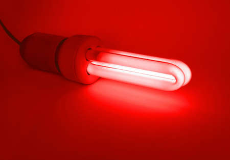 Compact fluorescent light bulb ecological low carbon - Red lightの写真素材