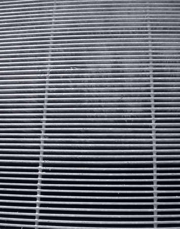 Steel grid iron metal mesh grunge backgroundの写真素材