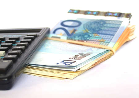 Euro banknotes money with a pocket calculatorの写真素材