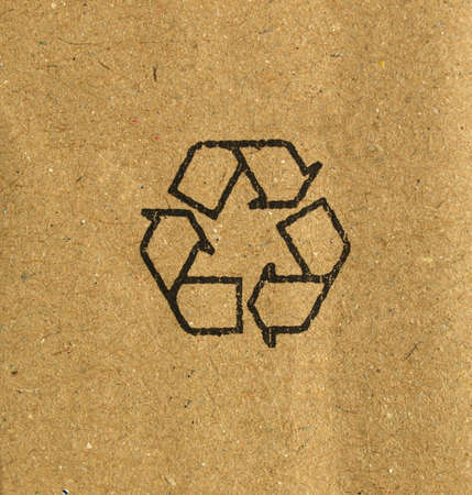 Brown corrugated cardboard with recycle symbolの写真素材