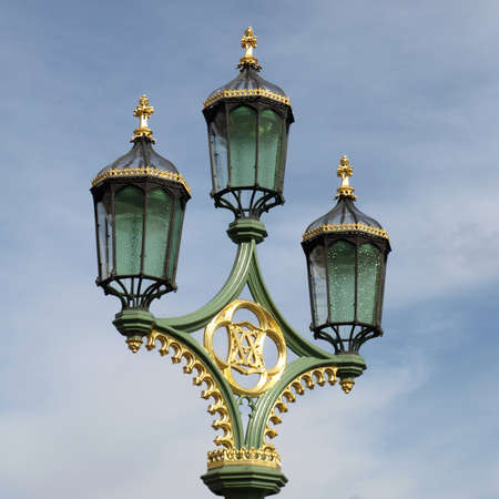 Old chandelier street light over blue skyの写真素材