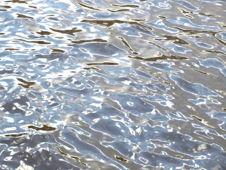Blue sea water with sun reflections, useful as a background