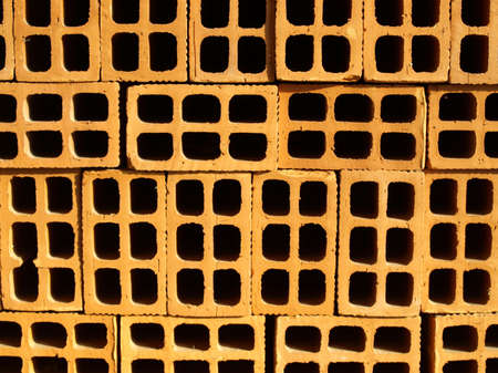 Range of red bricks (used as construction material)の写真素材