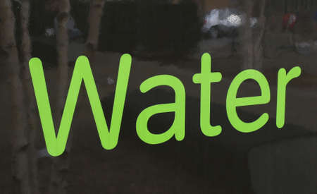 Word Water written on a reflective surfaceの写真素材