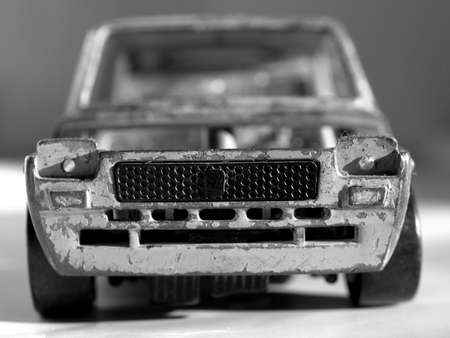 Old abandoned burned car isolated over whiteの写真素材