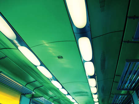 Rows of light in a train interiorの写真素材
