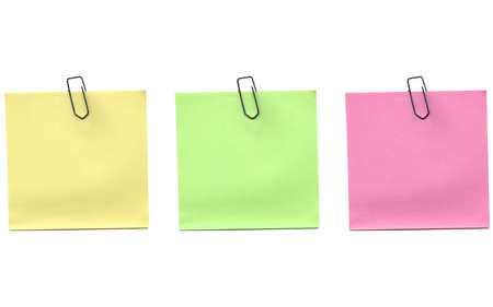 Yellow green and pink postit isolated over a white background