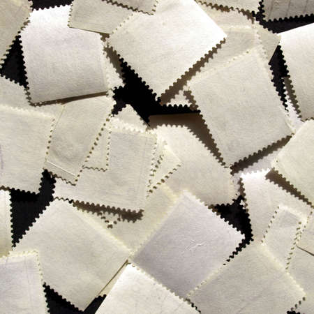 Blank stamps rear over a black backgroundの写真素材