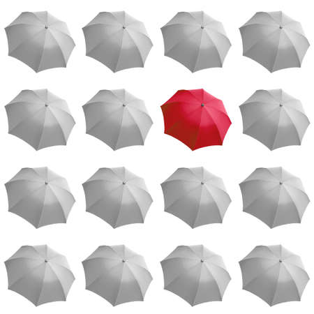Single red umbrella among many white umbrellasの写真素材