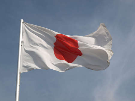 Flag of Japan over a blue skyの写真素材