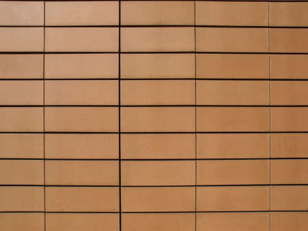 Orange ceramic terracotta tiles as a wall cladding