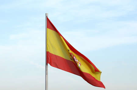 Flag of Spain over a blue sky