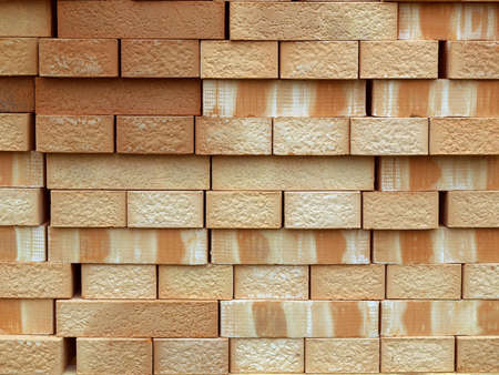 Pile or pallet of red bricks for constructionの写真素材