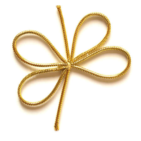 A golden ribbon over a white background