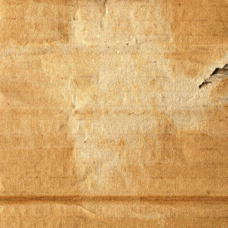 Old grunge corrugated cardboard useful as a backgroundの写真素材