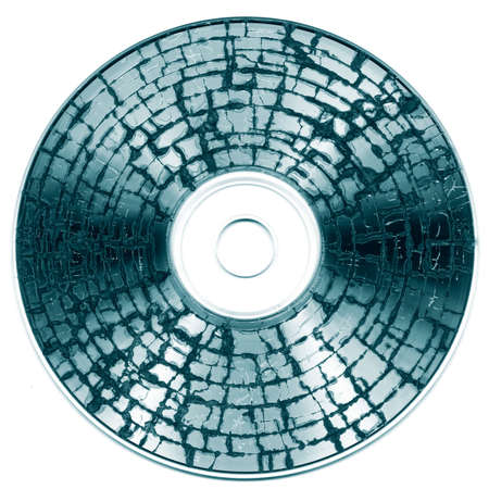 Damaged cd media showing the concept of data loss and disaster recovery backupの写真素材