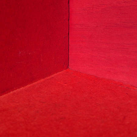 Box interior with red wooden room walls and floorの写真素材