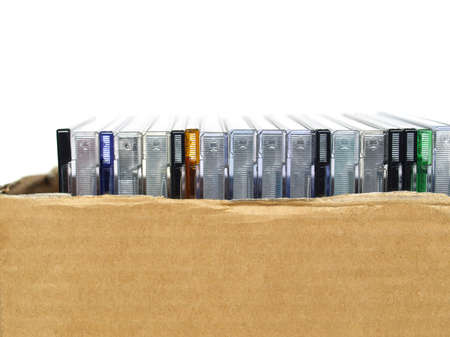CD or DVD for music data video recording - isolated over white background - in a corrugated cardboard boxの写真素材