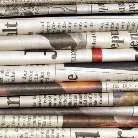 Detail of a pile of international newspapersの写真素材