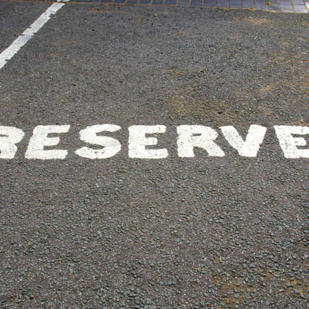 A road sign for a reserved parking areaの写真素材