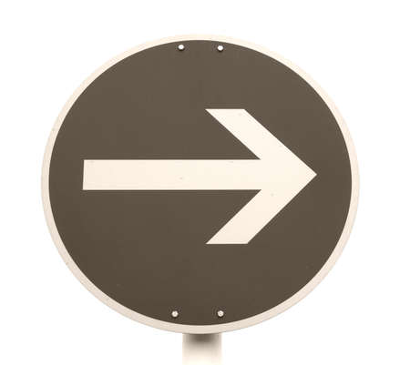 Arrow sign showing street road driving directionの写真素材