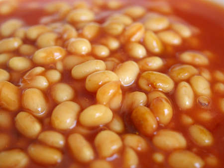 Detail of baked beans in tomato sauce - useful as a backgroundの写真素材