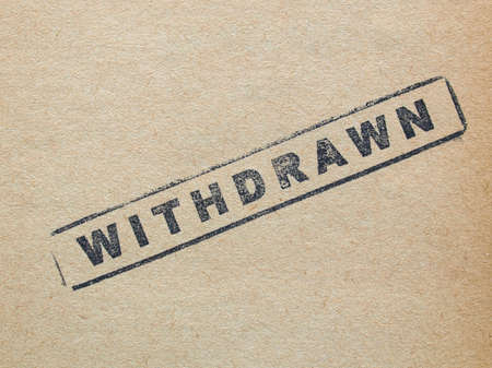 Withdrawn stamp on a book pageの写真素材