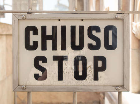 A traffic or a construction site sign - Chiuso stop