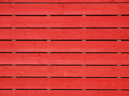 Red wooden fence useful as a backgroundの写真素材