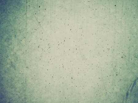Vintage looking raw concrete wall useful as a backgroundの写真素材