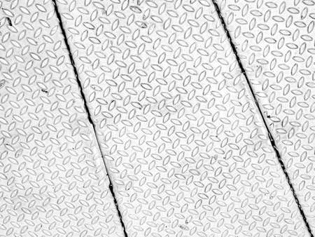 Black and white vintage looking steel plate useful as backgroundの写真素材