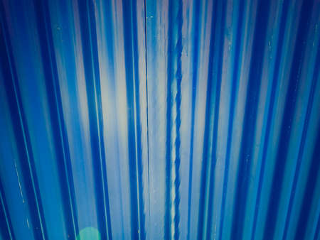 Vintage retro looking grunge blue steel plate useful as backgroundの写真素材