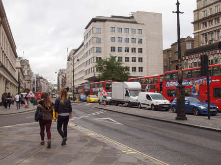 LONDON, ENGLAND, UK - OCTOBER 23: Tourists walking on The Strand busy high street on October 23, 2013 in London, England, UKのeditorial素材