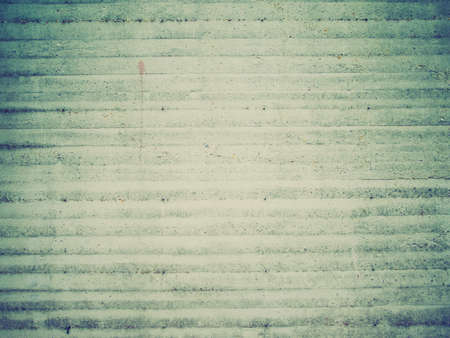 Vintage looking raw concrete wall useful as a backgroundの写真素材