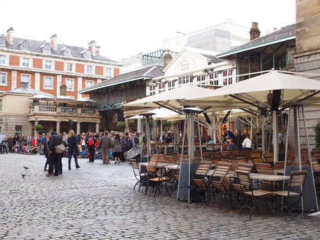 LONDON, ENGLAND, UK - OCTOBER 23: Tourists visiting the world famous Covent Garden on October 23, 2013 in London, England, UKのeditorial素材