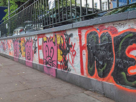 LONDON, ENGLAND, UK - JUNE 18, 2011: Graffiti by Beatles fans on the wall of the Abbey Road studios where the homonymous album was recorded in 1969のeditorial素材