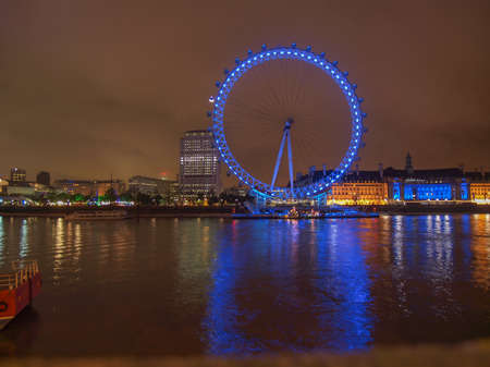 LONDON, ENGLAND, UK - JUNE 18, 2011: Night view of the London Eye ferris wheel on the South Bank of River Thames aka Millennium Wheel built in 1999 using advanced aeronautical engineering know how by British Airwaysのeditorial素材
