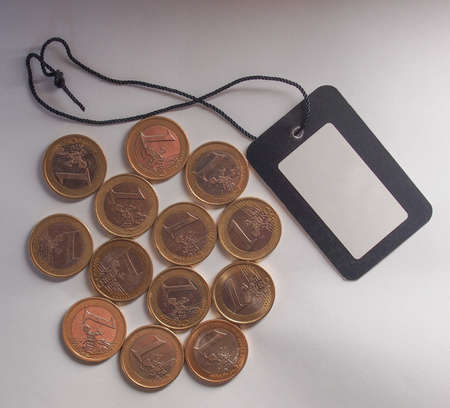 Many Euro coins (currency of the European Union) with price tag label