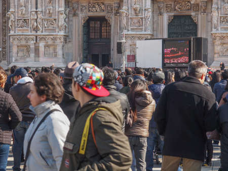 MILAN, ITALY - FEBRUARY 23, 2014: People attending mass in front of Milan cathedral celebrated by...