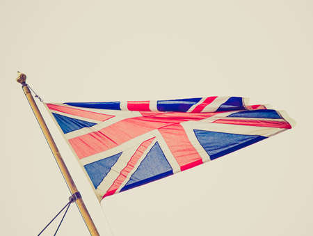 Vintage retro looking Union Jack national flag of the United Kingdom (UK) - isolated over white backgroundの写真素材