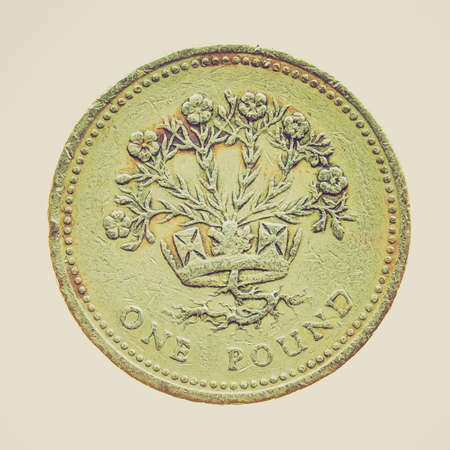 Vintage looking One Pound coin isolated over a white backgroundの写真素材