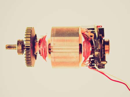 Vintage looking Detail of a rotary electric engine motor - isolated over white backgroundの写真素材