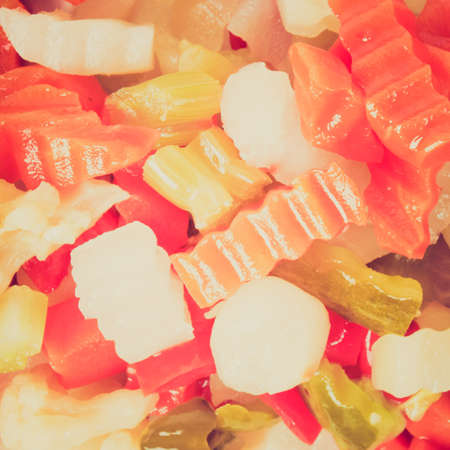 Vintage looking Mixed vegetables as used in Russian Salad including carrots turnips courgettes zucchini cauliflower peppers celery onionsの写真素材