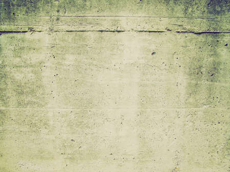 Vintage looking Raw concrete wall useful as a backgroundの写真素材
